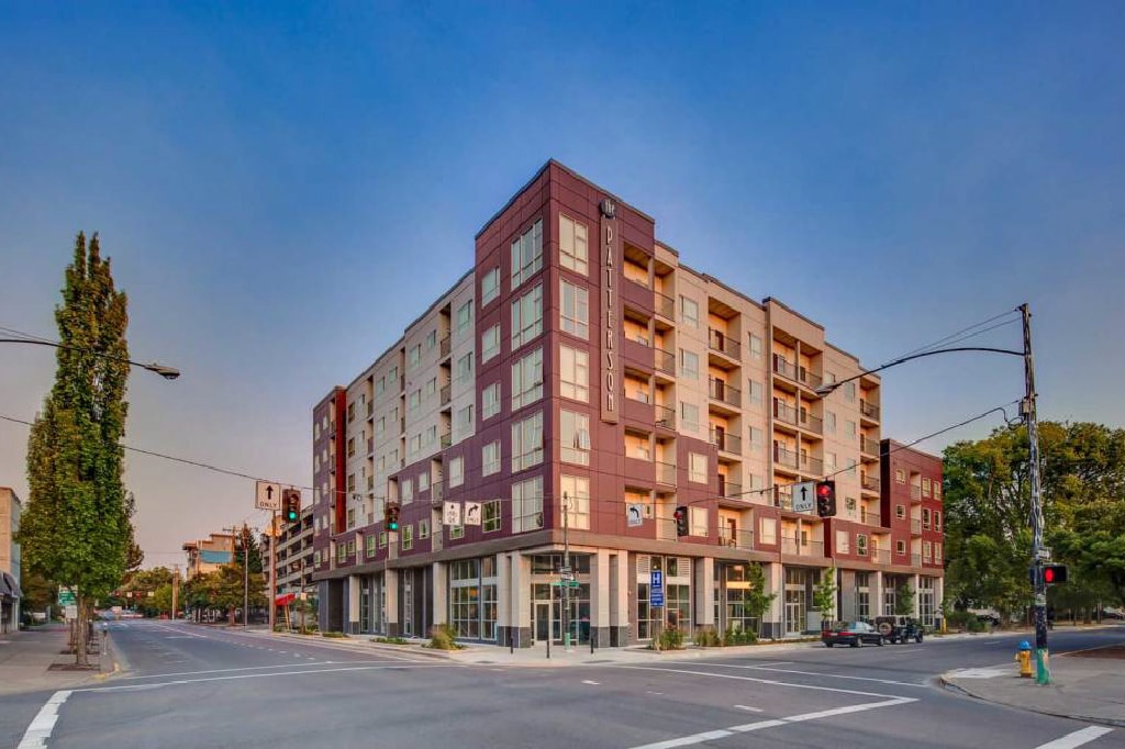 Wide Angle of Mixed Use Development Building featuring Norstone Grey Aksent 3D Stone Veneer on the ground floor